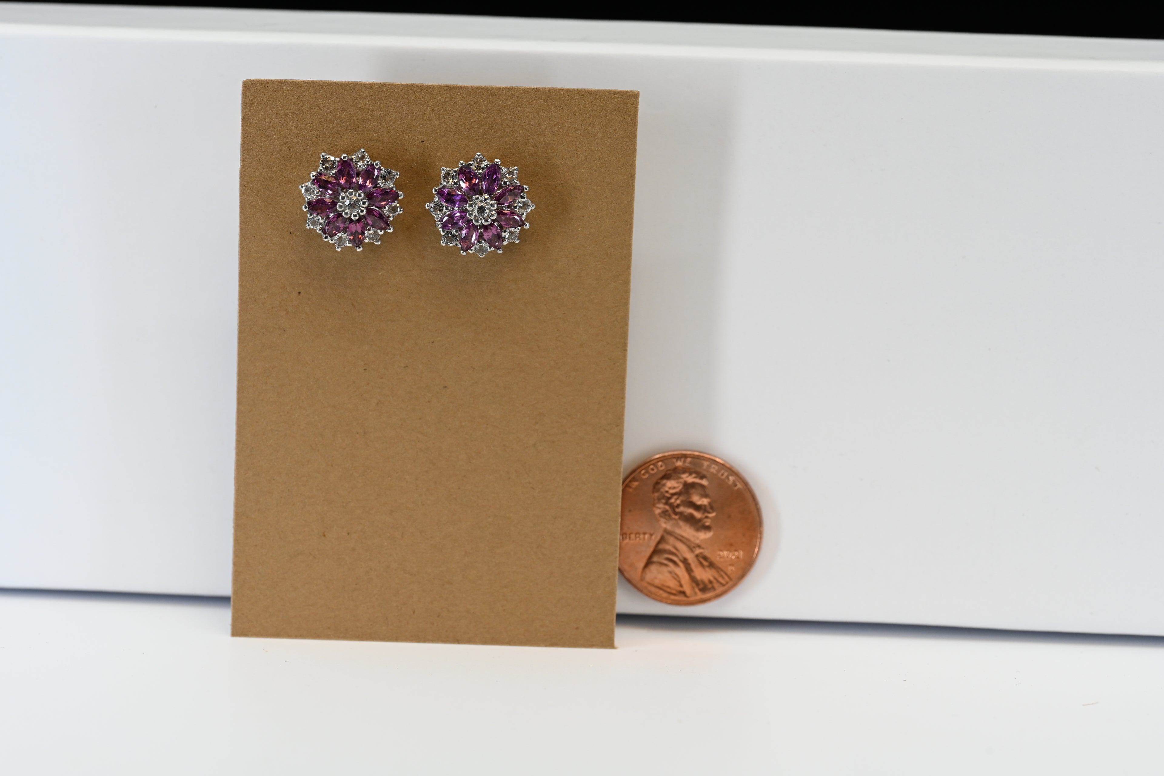 Sterling Silver Marquise Cut Purple Stones with Round Colorless Stones Stud earrings