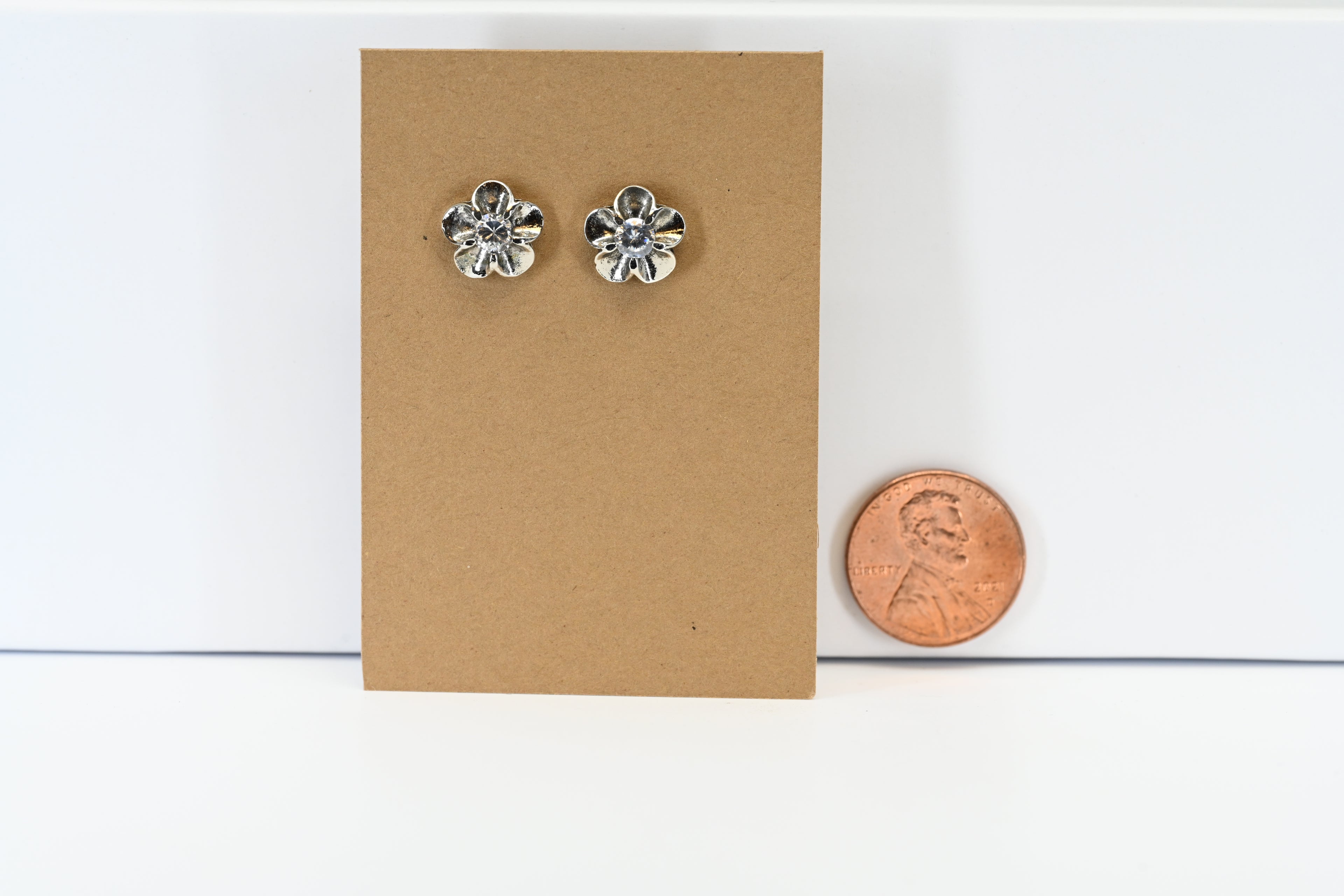 Sterling Silver Flower Stud Earring With Round Center Colorless Stone