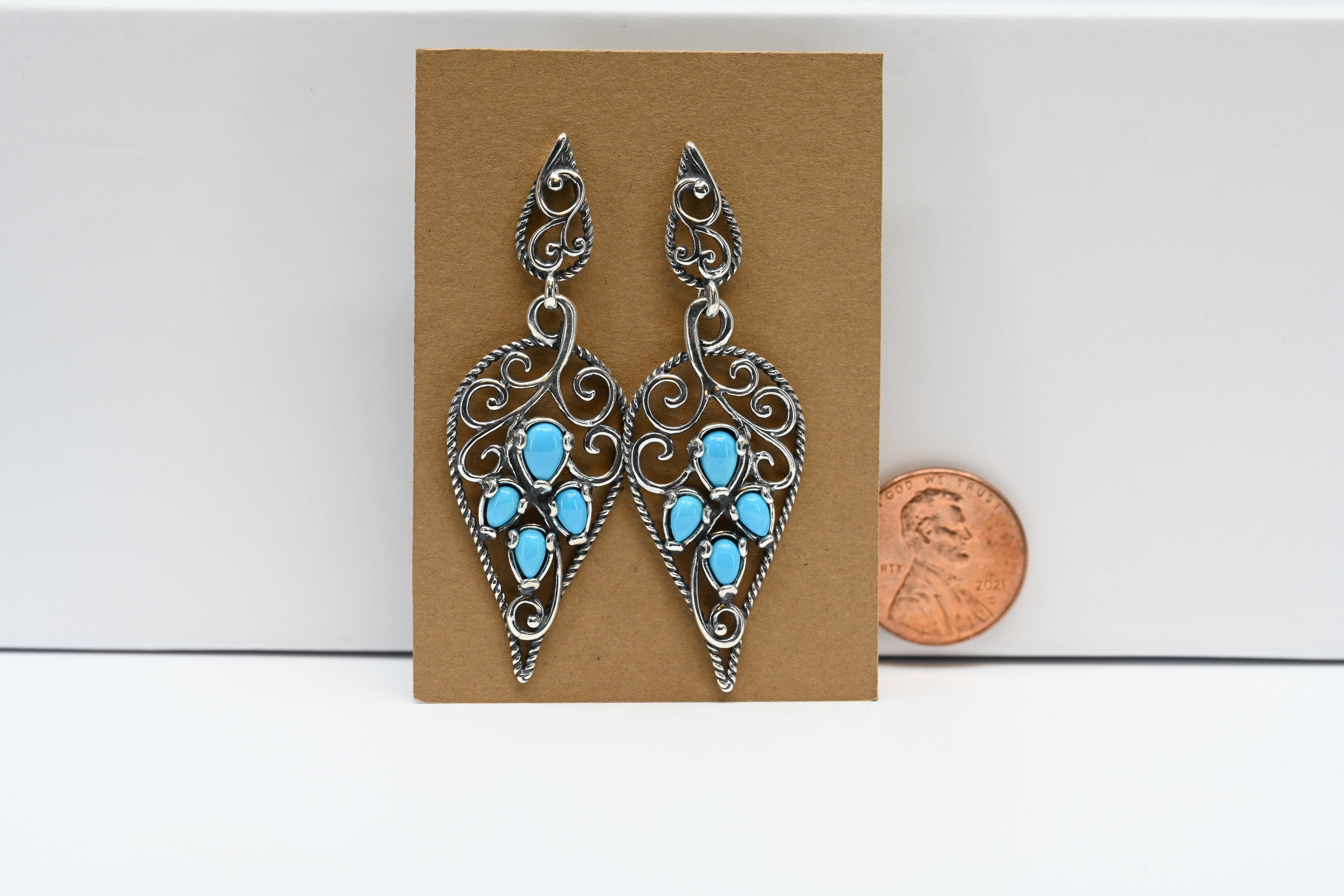 Sterling Silver Dangle Earring With Light Blue Cabochon Cut Stones