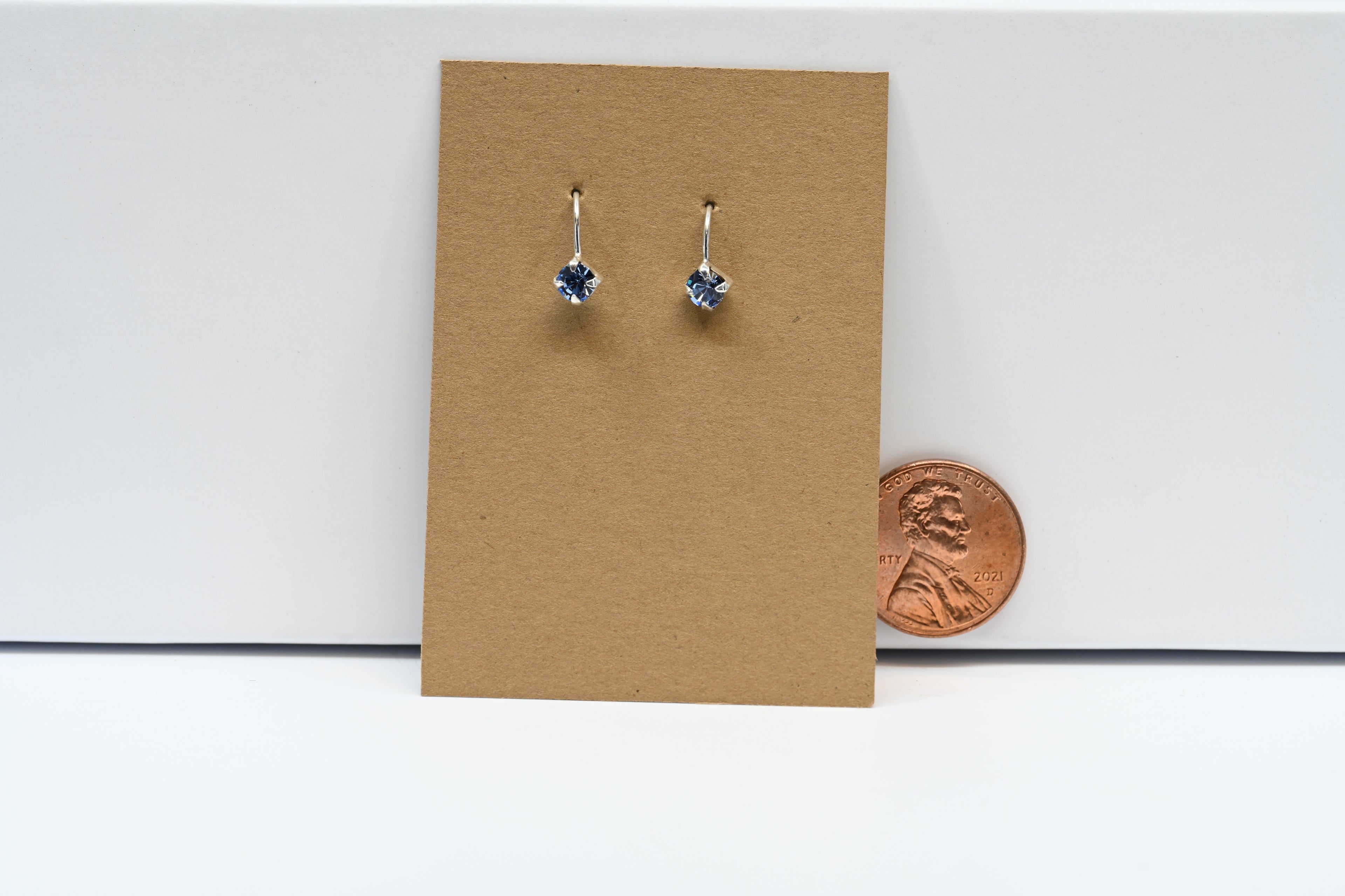 Sterling  Silver Drop Earring With Light Blue Round Stone