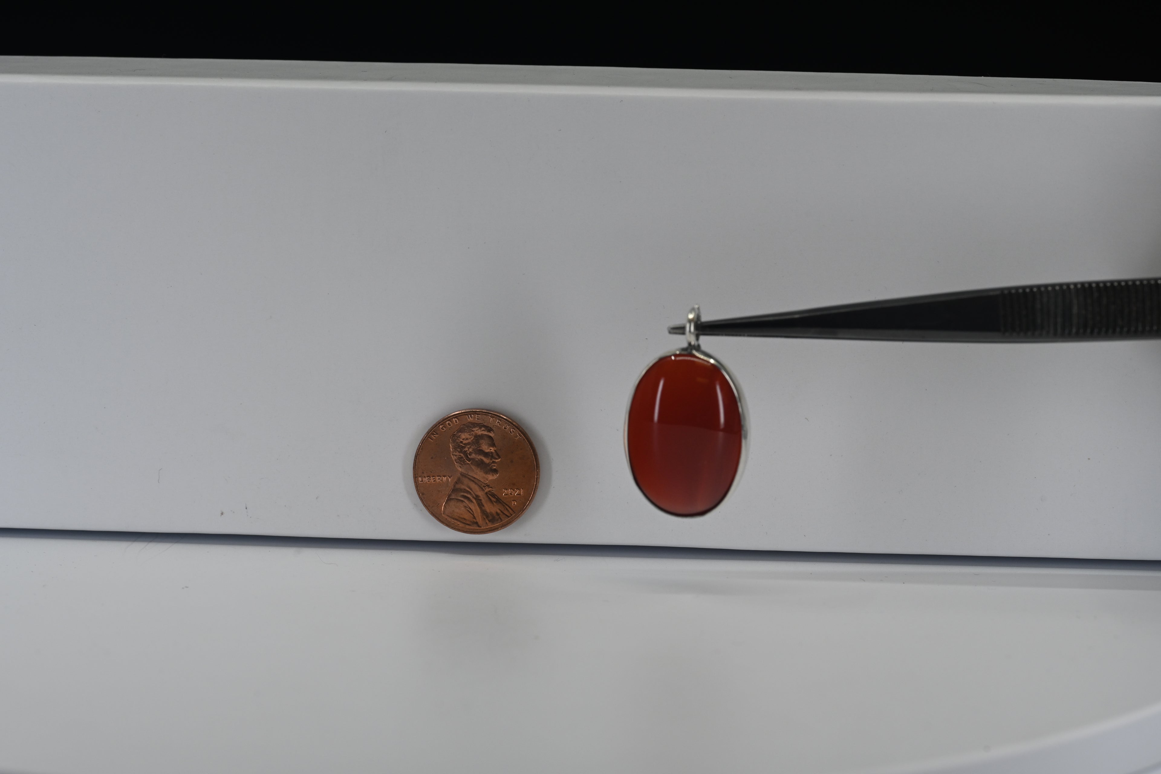 Sterling Silver Oval Cabochon Cut Reddish Pendant