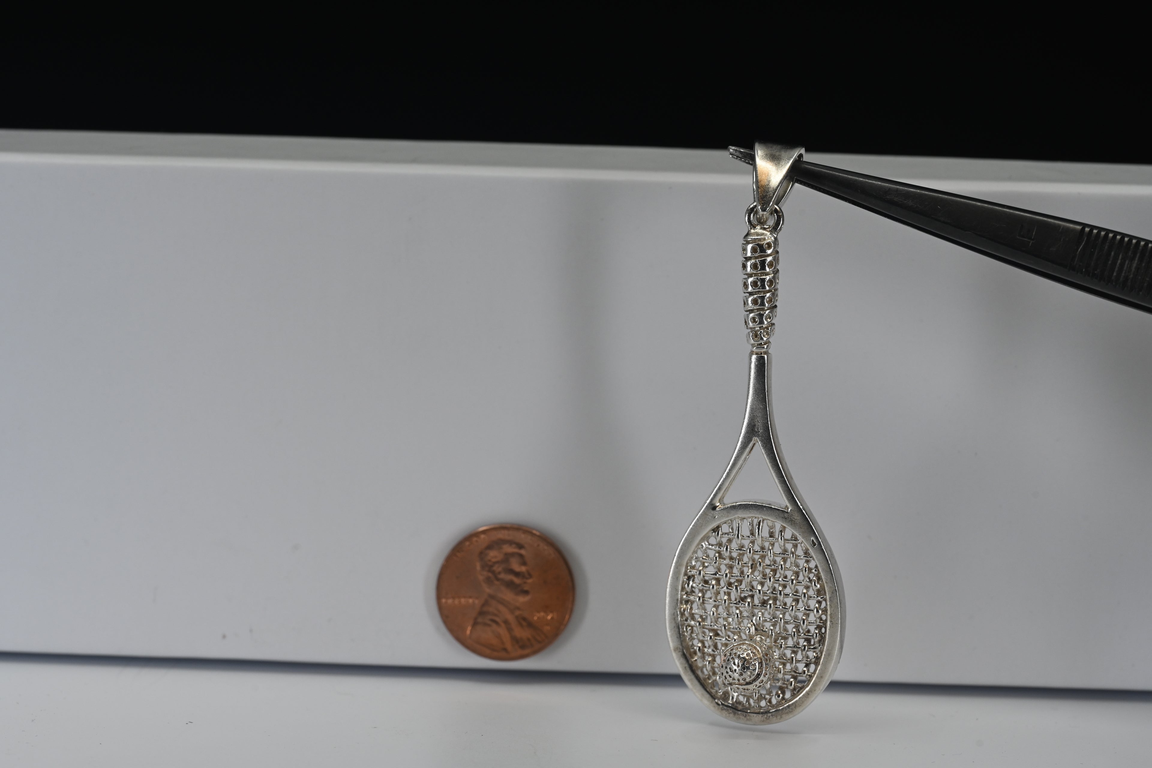 Sterling Silver Tennis Racket With Ball Pendant