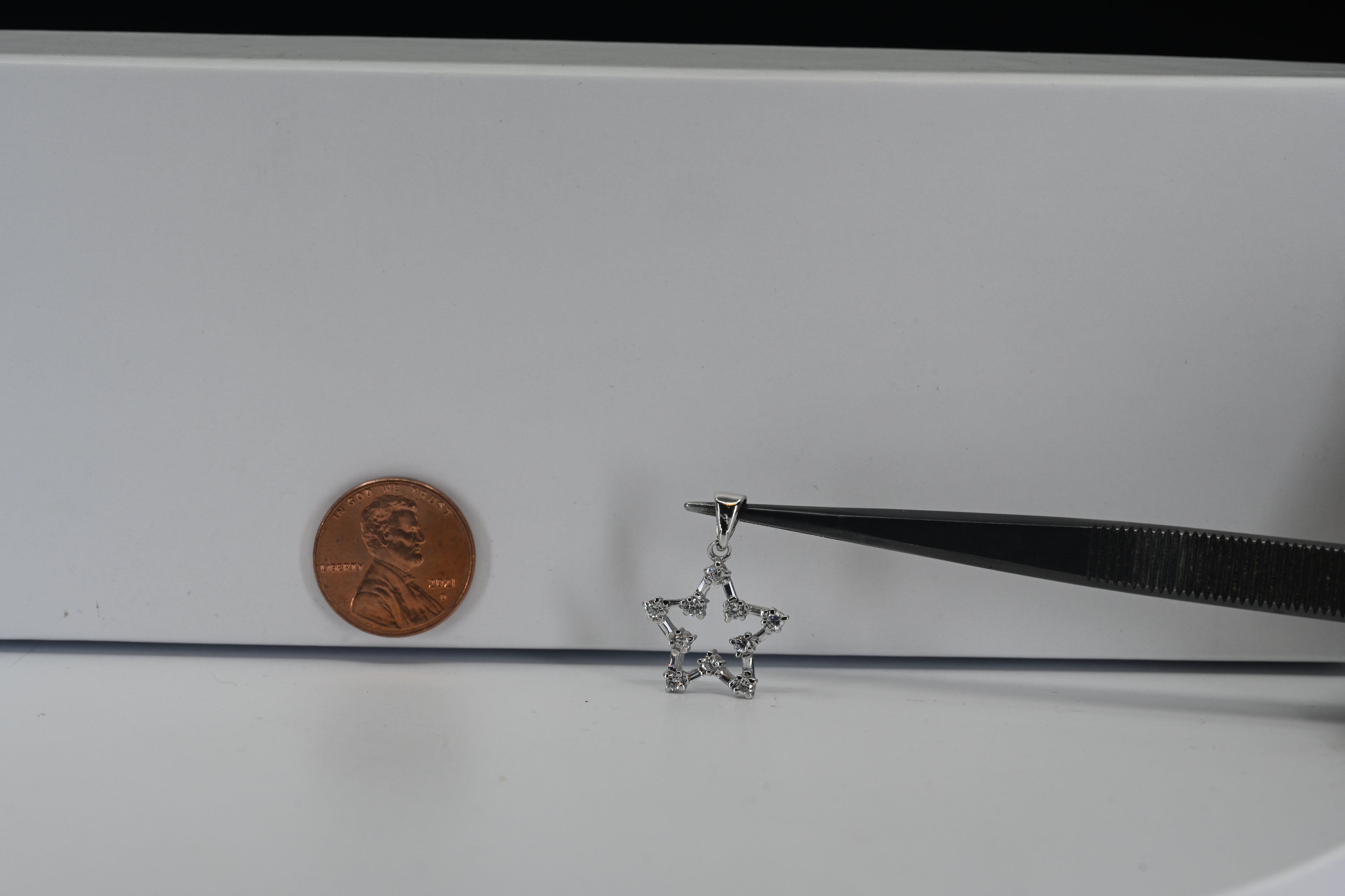 Sterling Silver Star Pendant With Round and Baguette Colorless Stones