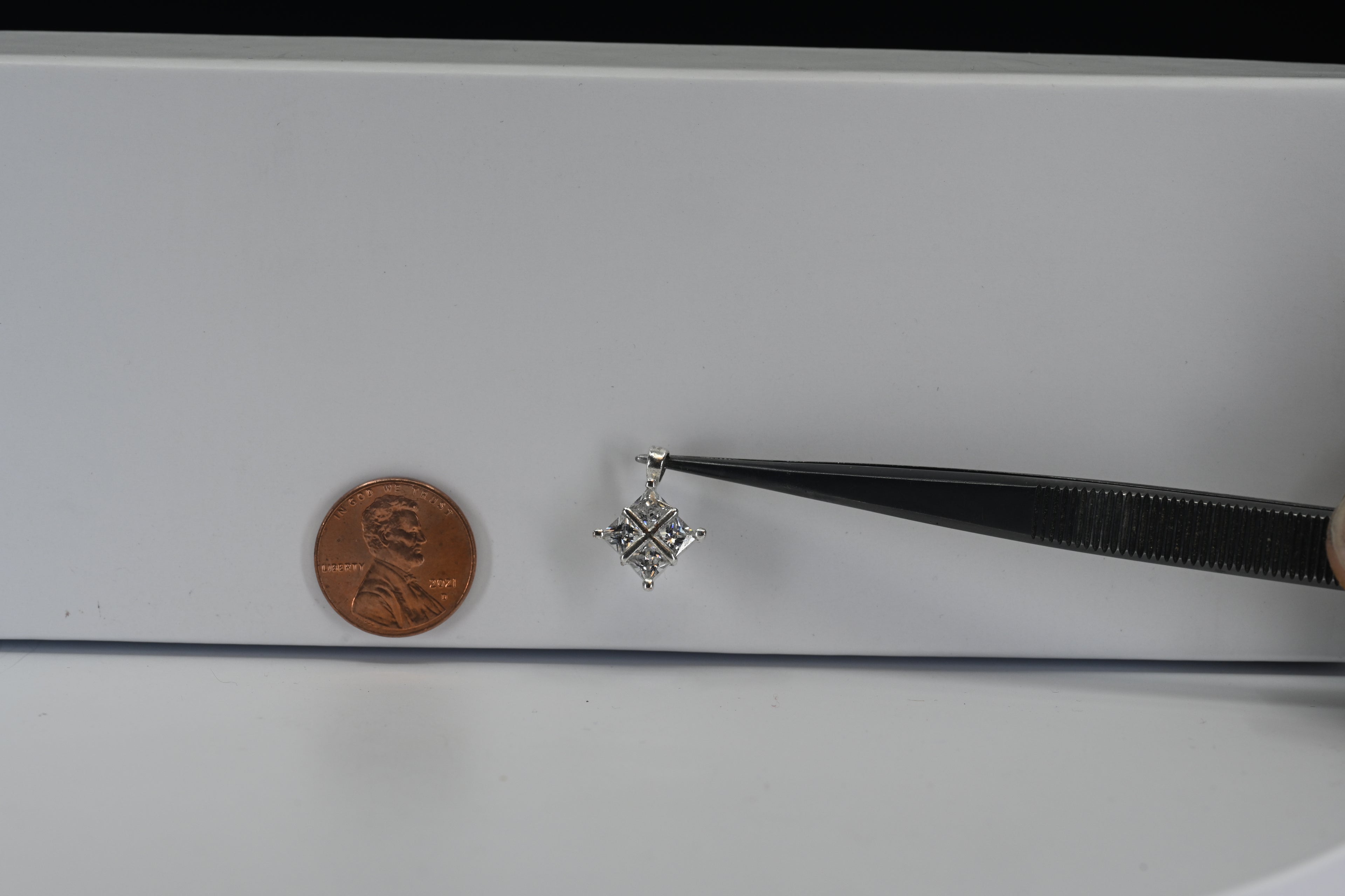 Sterling Silver Square Pendant With Four Princess Cut Colorless Stones