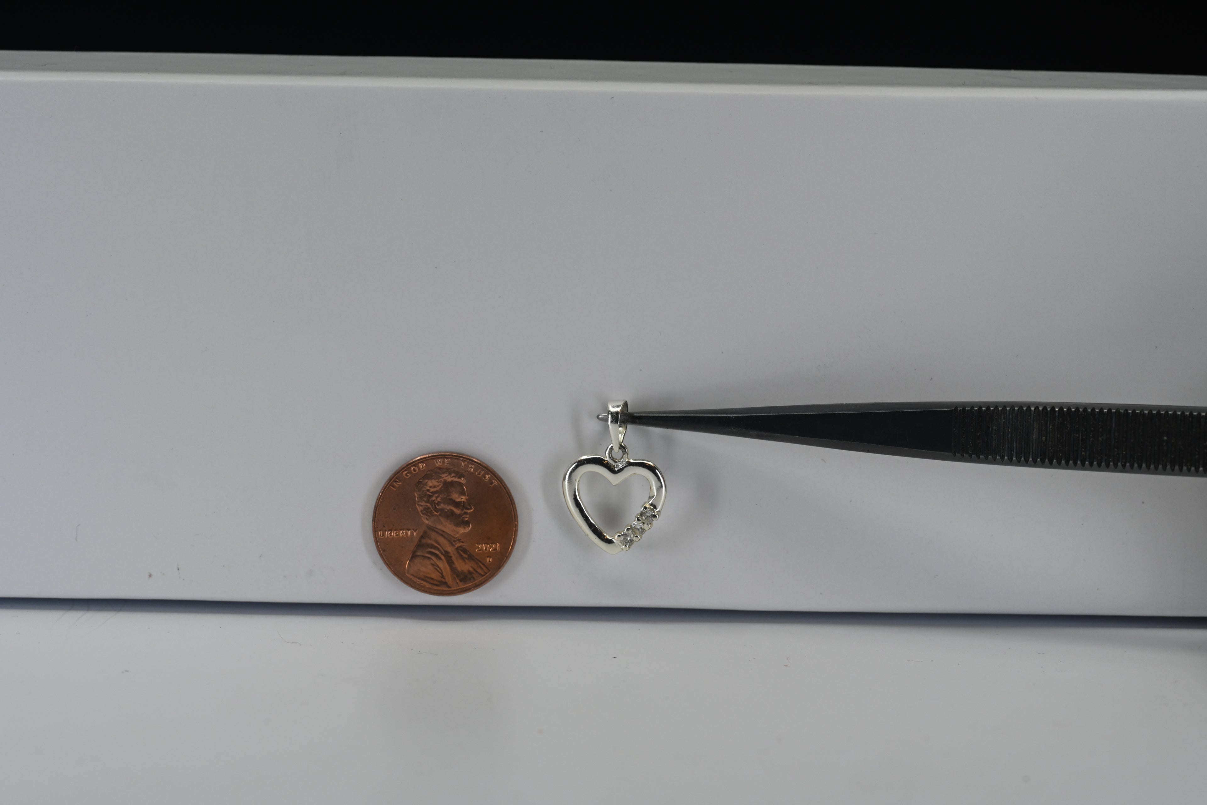 Sterling Silver Three Round Colorless Stone Heart Pendant