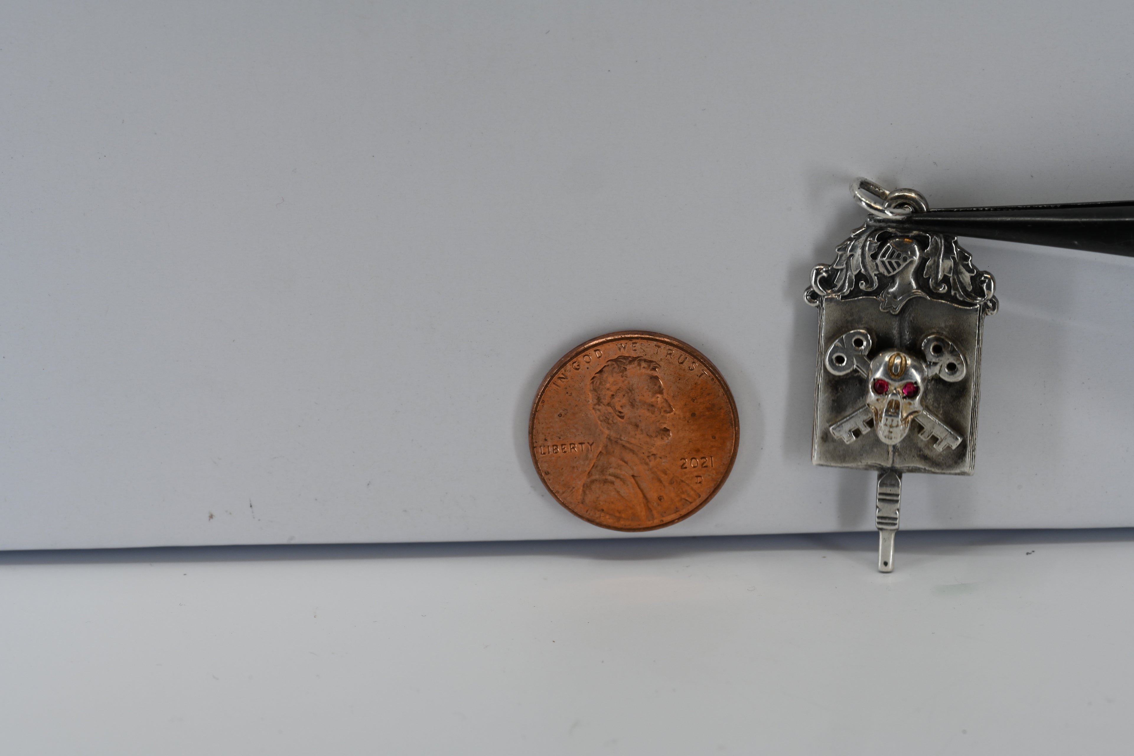 Sterling Silver Skull and Key with Red Eyes Pendant