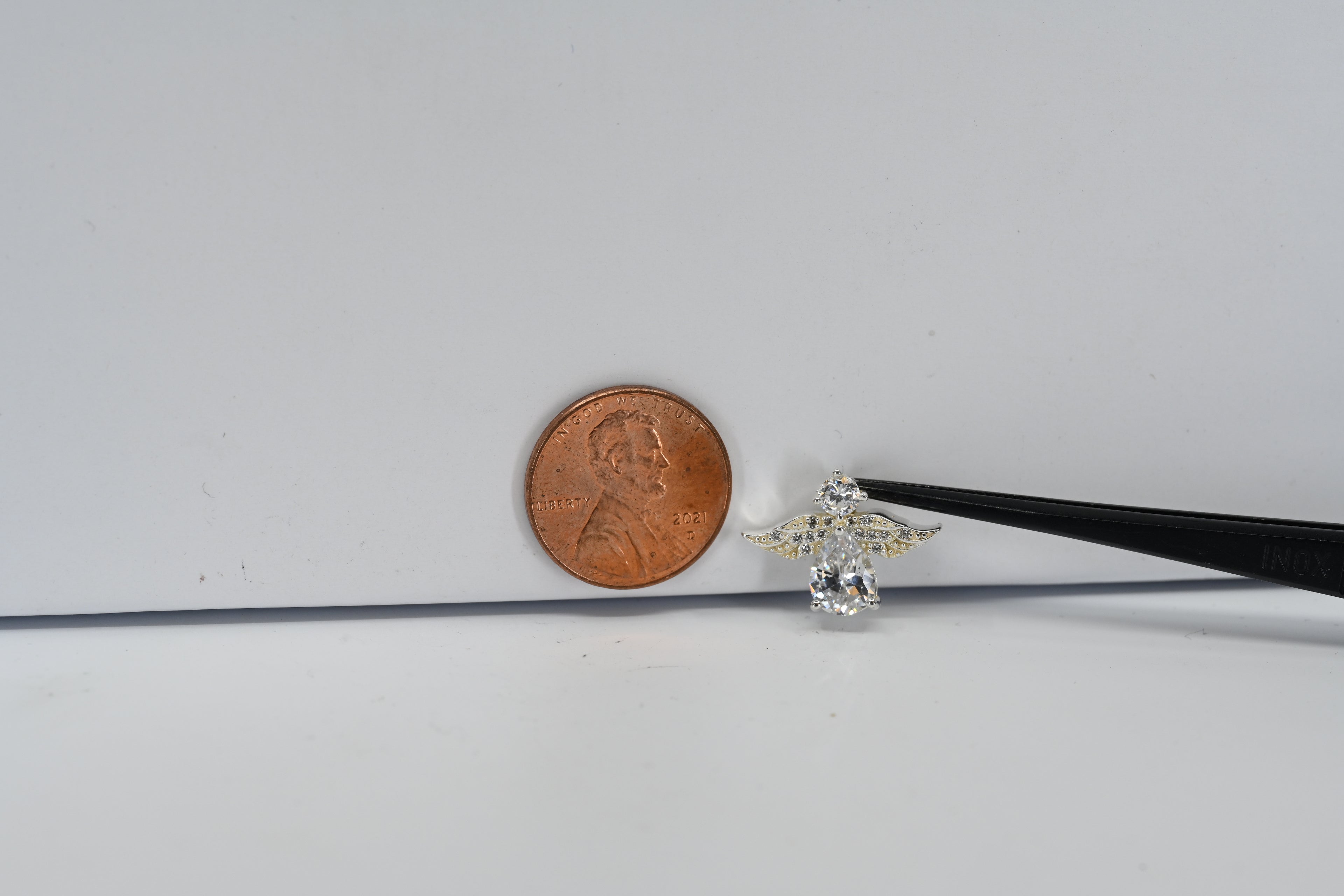 Sterling Silver Angel With Colorless Pear and Round Shaped Stone Charm