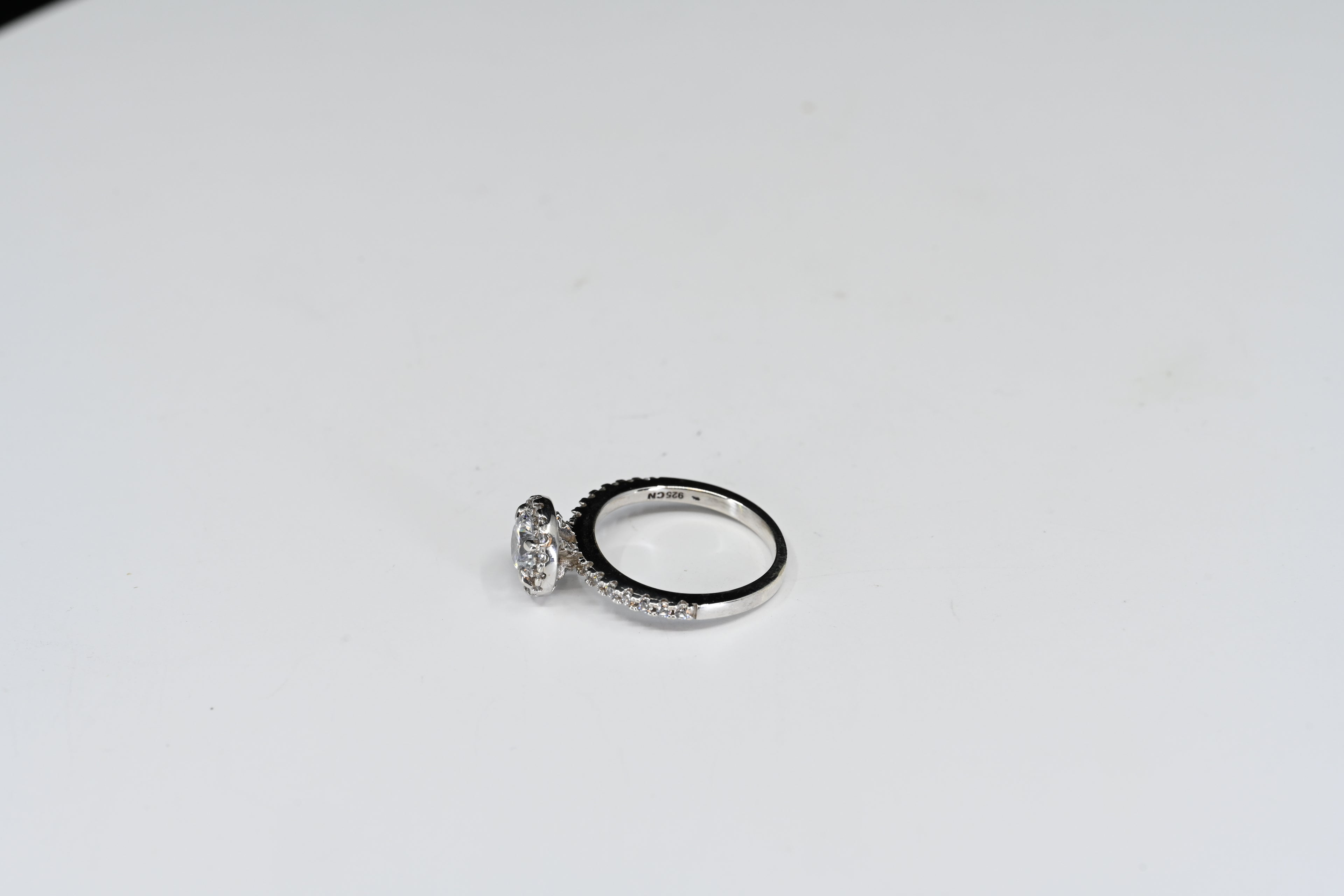 Sterling Silver Round Colorless Stones With Halo And Down The Sides Ring