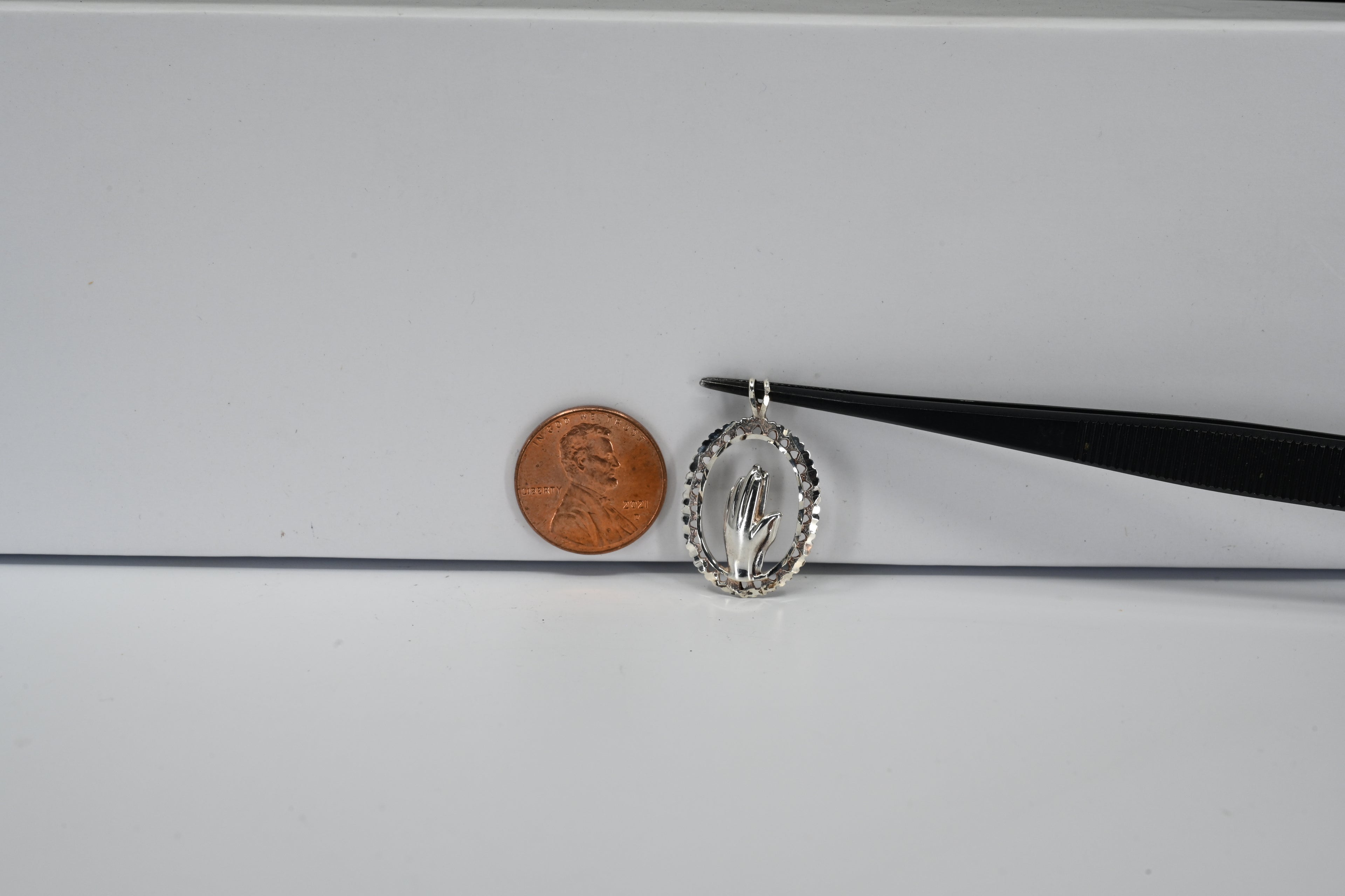 Sterling Silver Oval With Hand Pendant