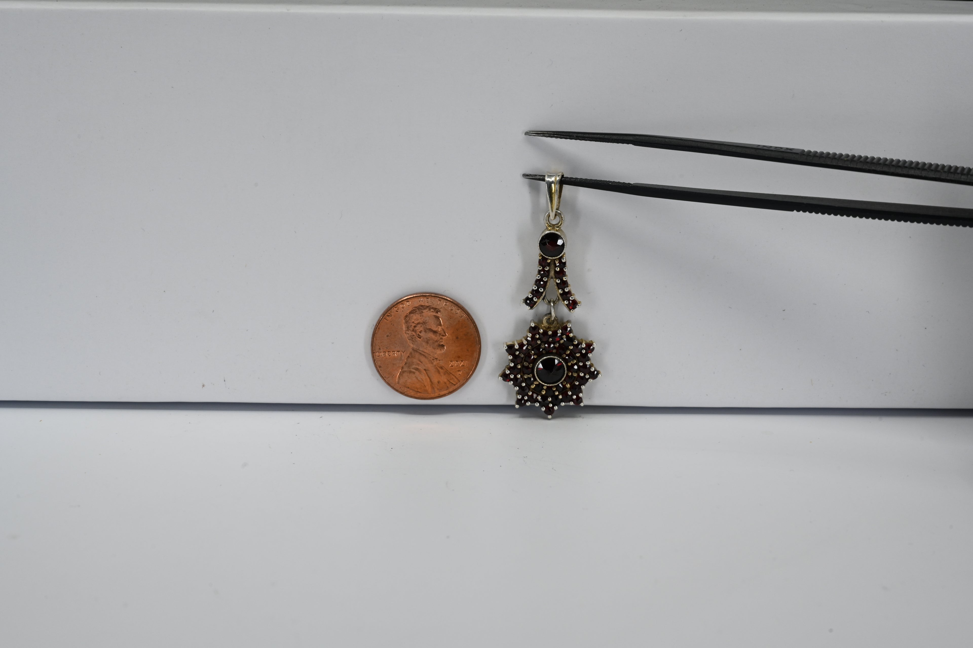Sterling Silver Round Red Stones Floral Drop Pendant