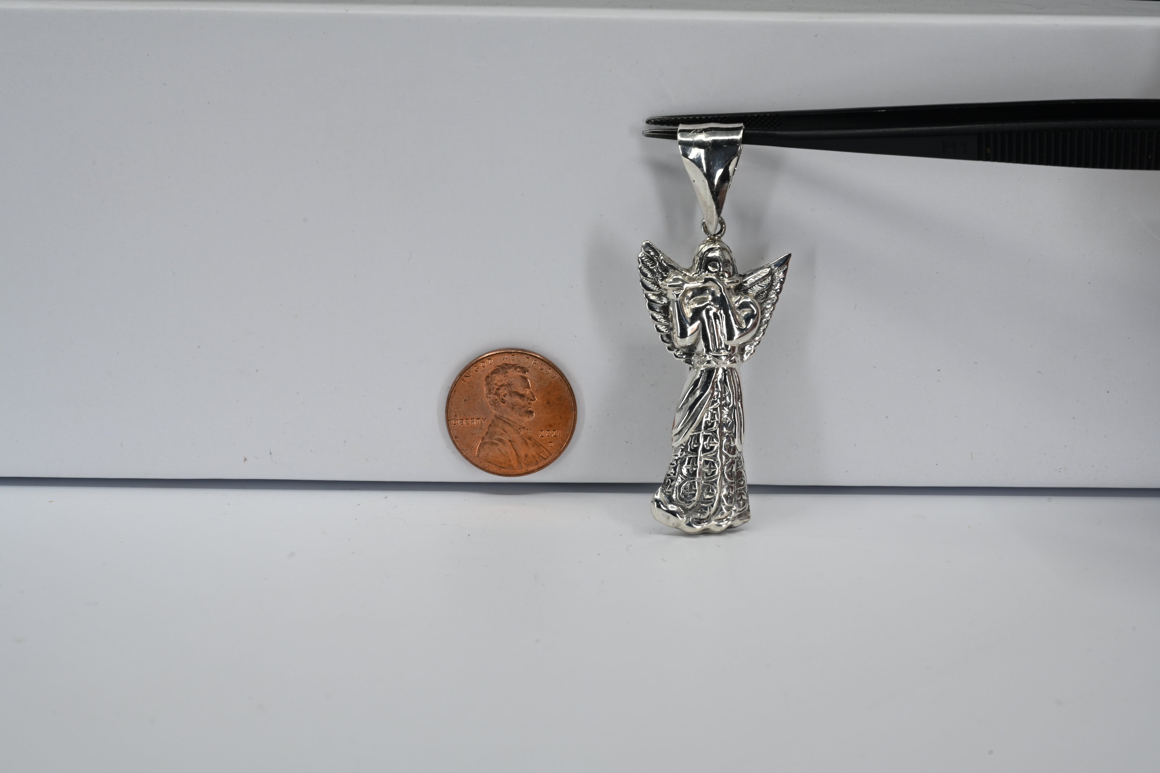 Sterling Silver Angel Playing A Flute Pendant